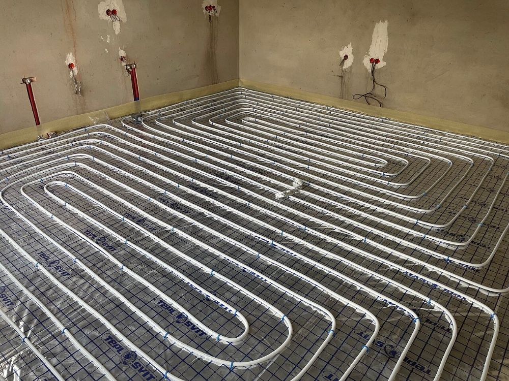Underfloor heating pipe laid in loops across a room